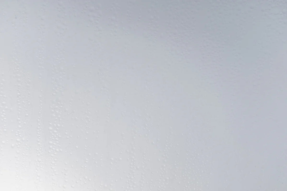 a white wall with water drops on it