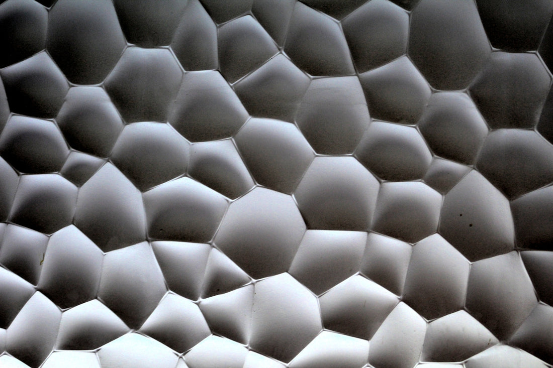 a close up view of a wall made of hexagonal shapes