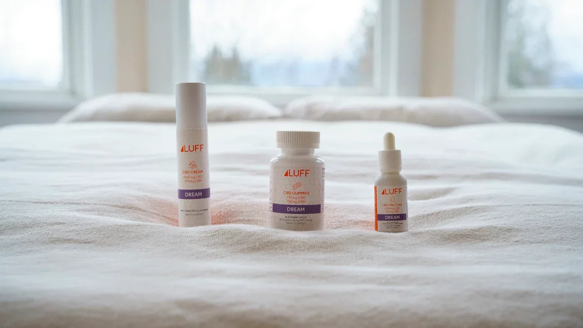 three white plastic bottles on white textile