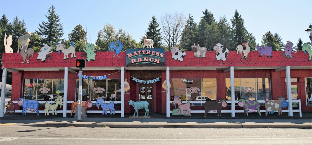 a red building with a bunch of stuffed animals on top of it