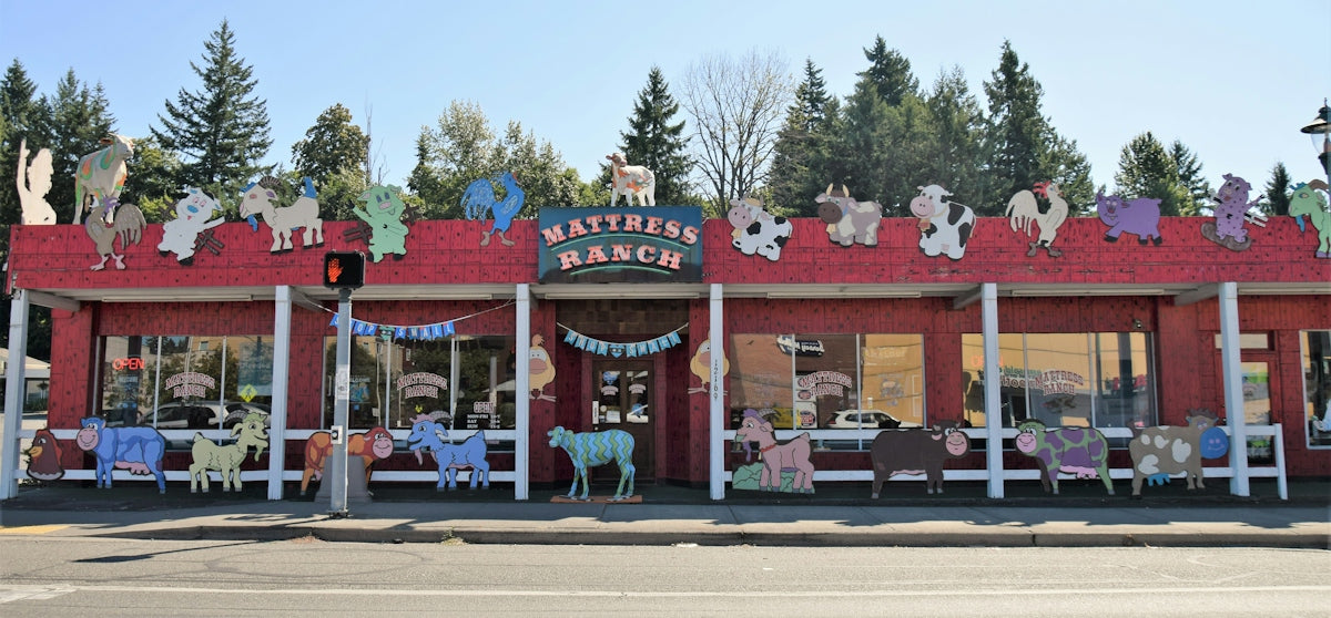 a red building with a bunch of stuffed animals on top of it