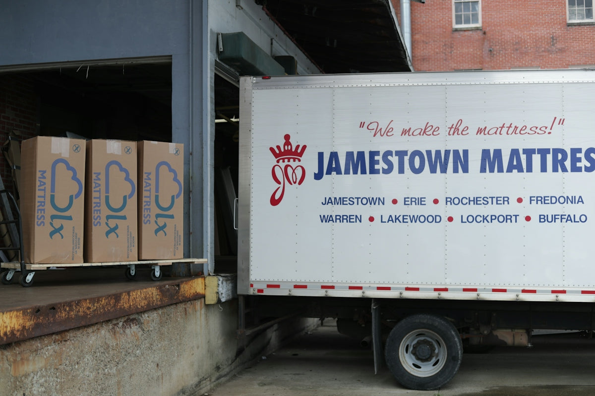 a truck parked in front of a brick building