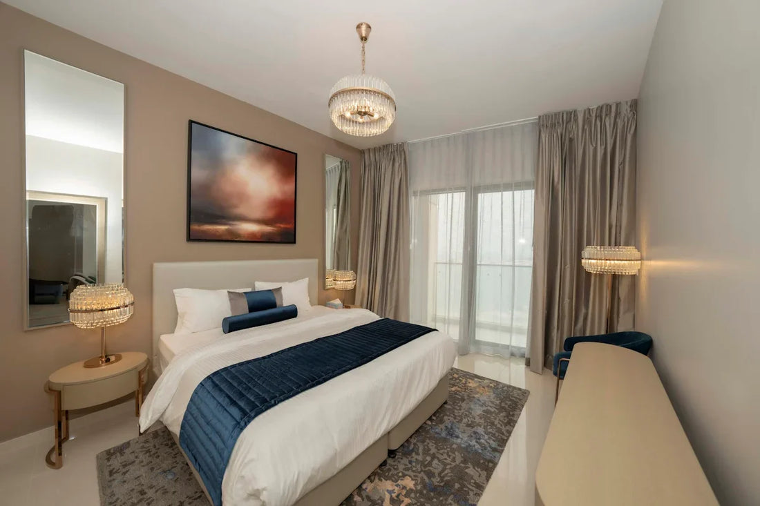 A bedroom with a large bed and a painting on the wall