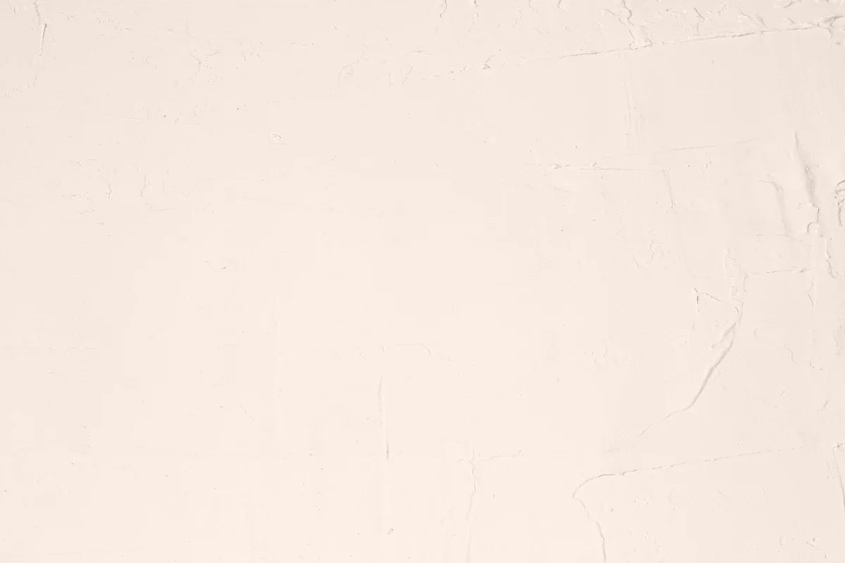 A white sheet with a black cat sitting on top of it