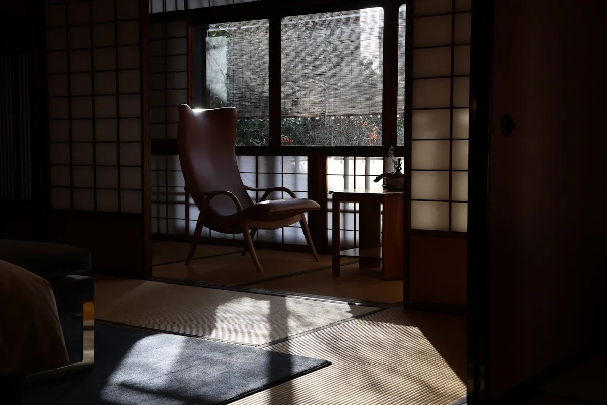 A room with a chair and a window in it