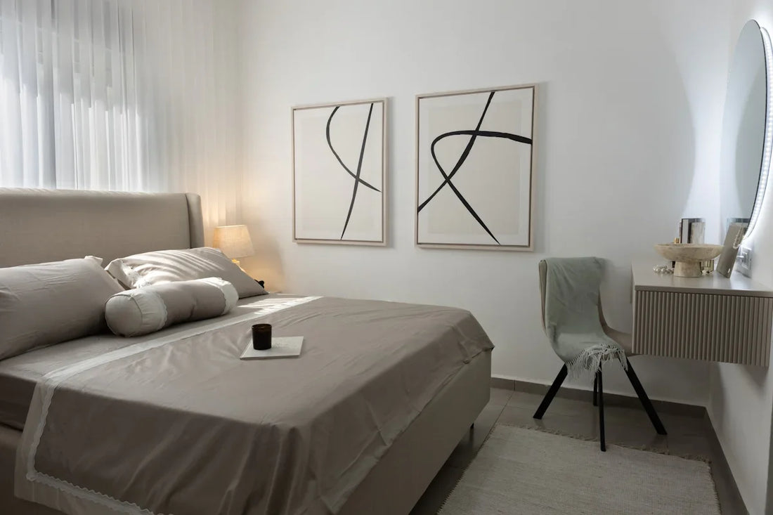 A modern bedroom with a bed and vanity table.
