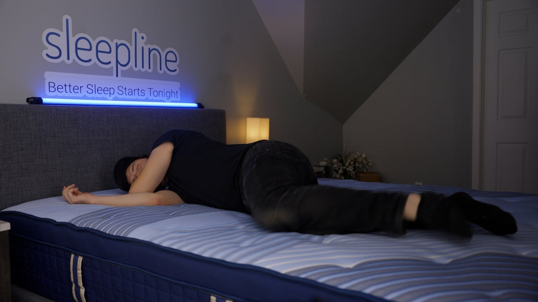 Person sleeping on their side on a mattress.