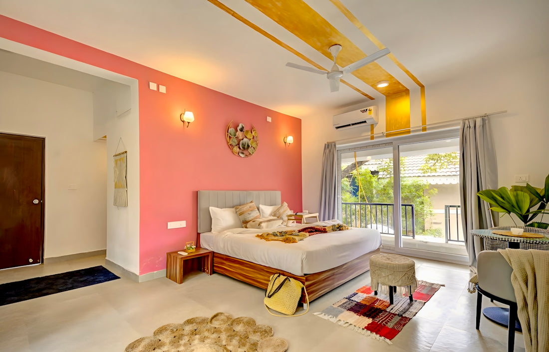 Stylish bedroom with a pink accent wall and balcony access.