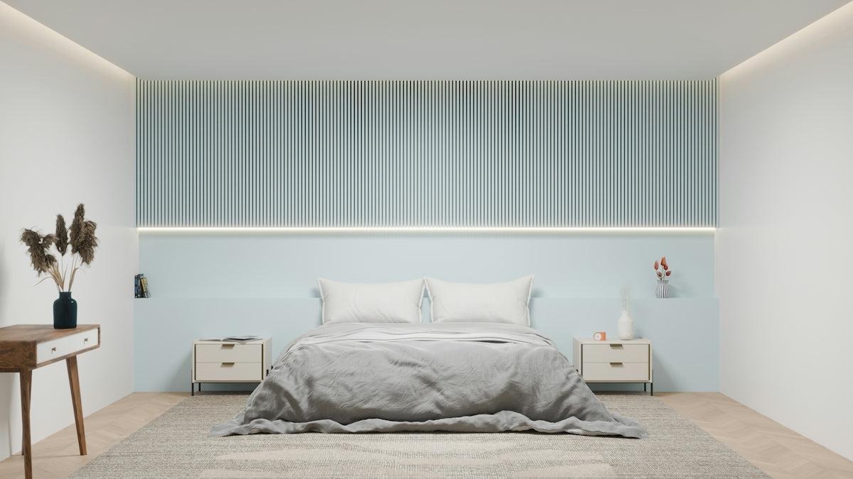 A modern bedroom with a grey bed, slatted wall paneling, and two nightstands