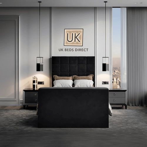 Modern bedroom featuring a upholstered TV bed with cube-stitched headboard and UK Beds Direct logo on the wall