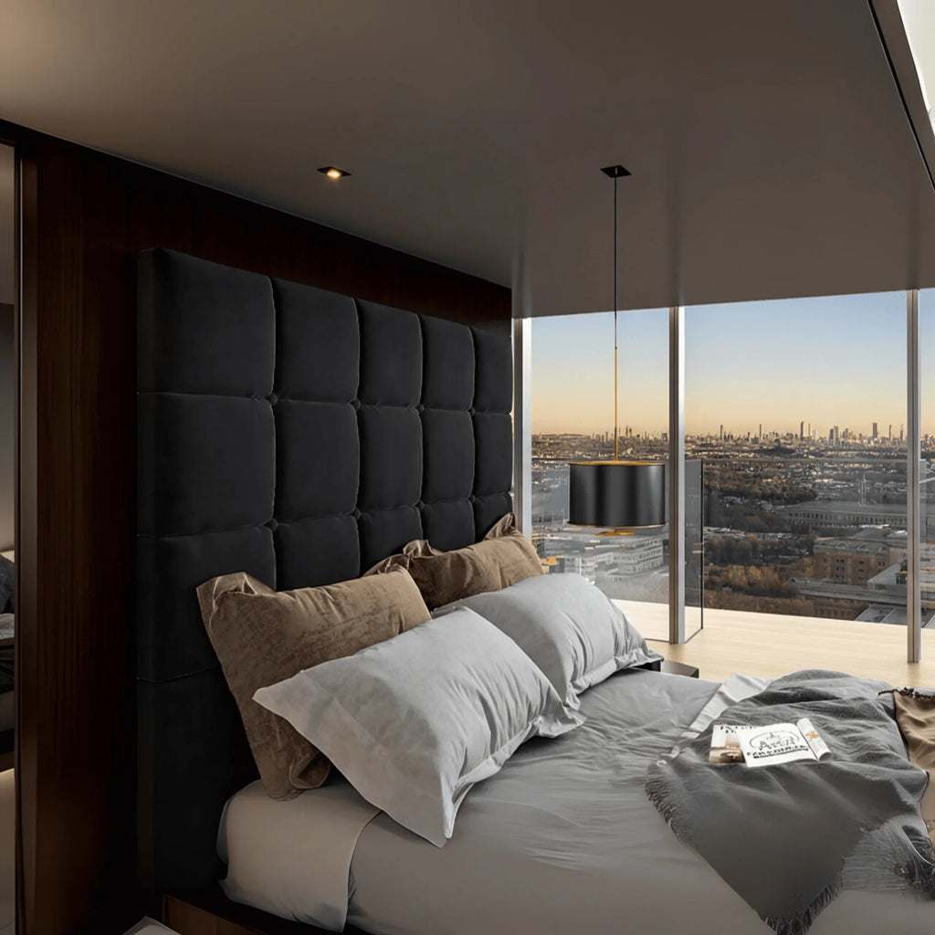 Modern bedroom featuring a upholstered TV bed with cube-stitched headboard and UK Beds Direct logo on the wall