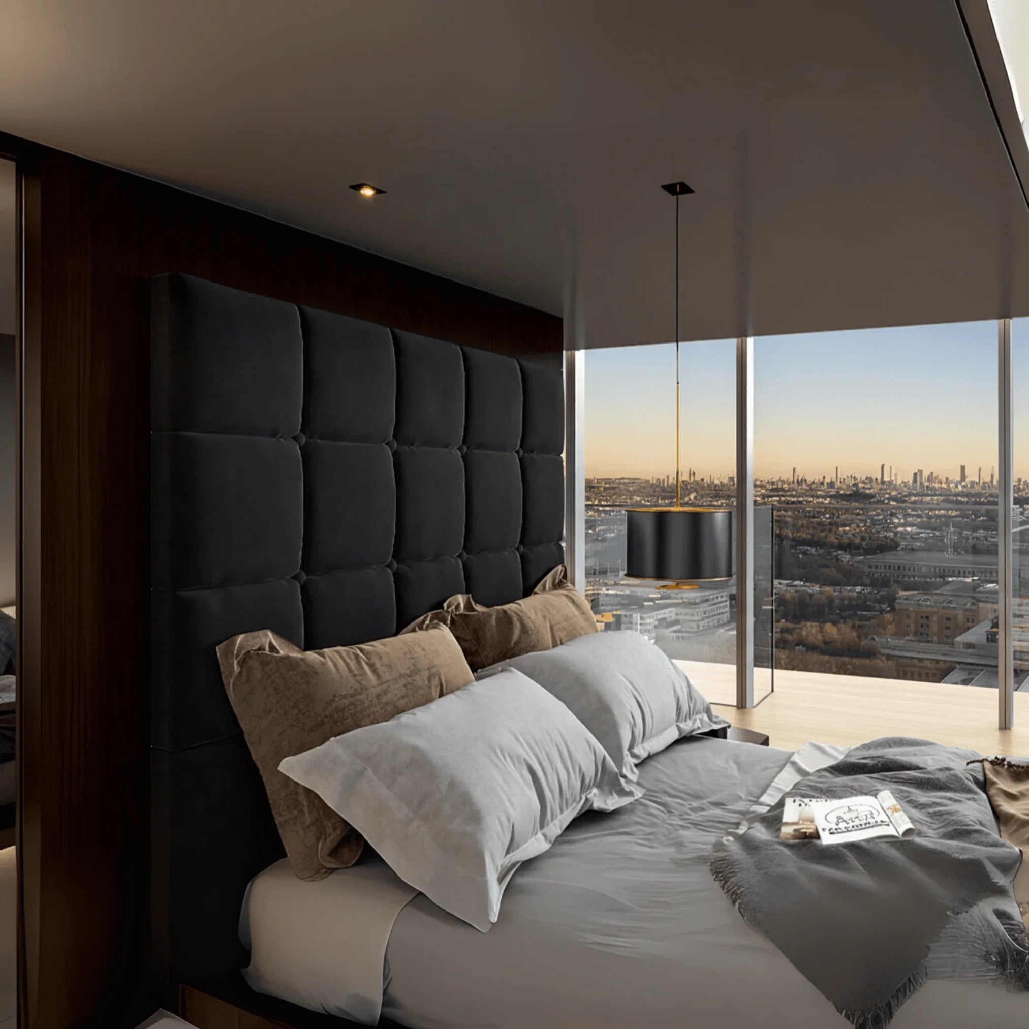 Modern bedroom featuring a upholstered TV bed with cube-stitched headboard and UK Beds Direct logo on the wall