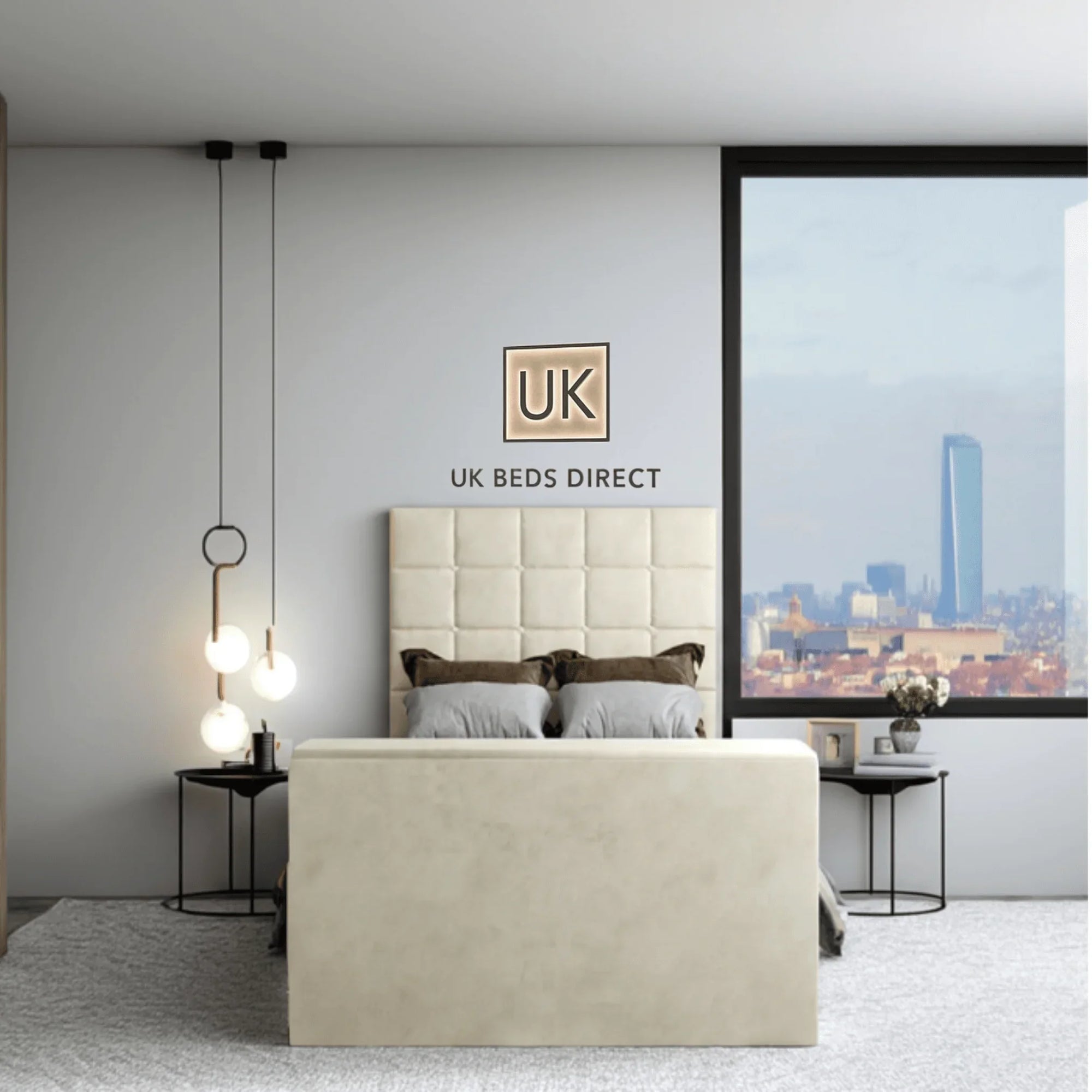 Modern bedroom featuring a upholstered TV bed with cube-stitched headboard and UK Beds Direct logo on the wall